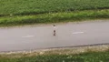 The man standing on the road. quadrocopter shot 4k or 4k+ Resolution