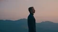 The man standing on the rock against the sunset background 4k or 4k+ Resolution
