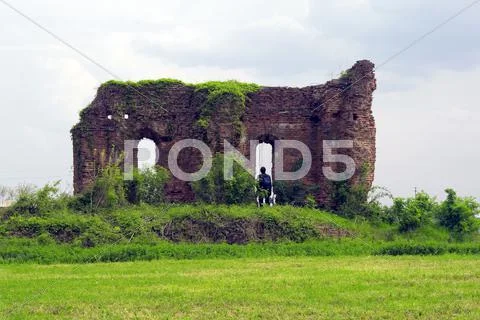 Man Standing In Ruins Suggesting Homelessness Stock Photos