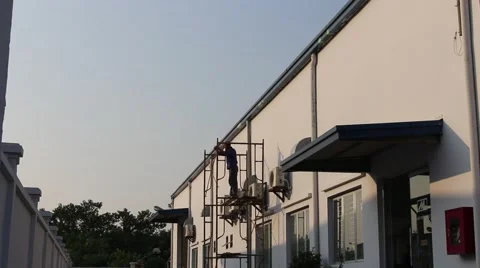 Man standing on scaffolding Stock Footage 58626094