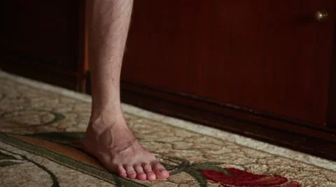 Man standing serially on right and left foot Stock Footage 65370714
