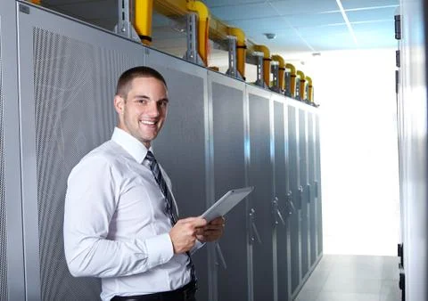 Man standing in server room Stock Photos