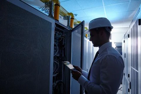 Man standing in server room Stock Photos