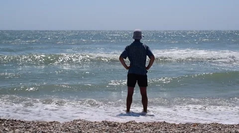 Man standing on the shore Stock Footage 66357617