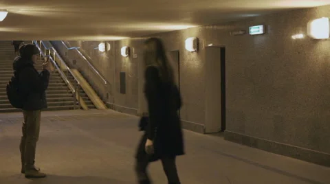 Man standing with a smartphone in the underpass Stock Footage 59955278