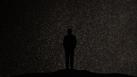 The man standing on a snow falling background Video stock 165353037