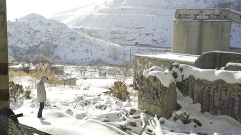 Man Standing in Snow, Graffiti In Background Stock Footage 97201576
