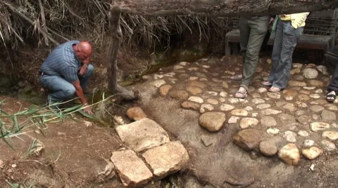 Man standing at spring John the Baptist Jordan river Stock Footage 8776735
