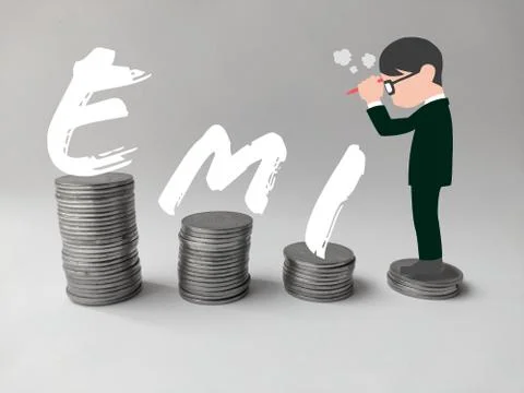 Man standing on stack of coins thinking about EMI Stock Photos