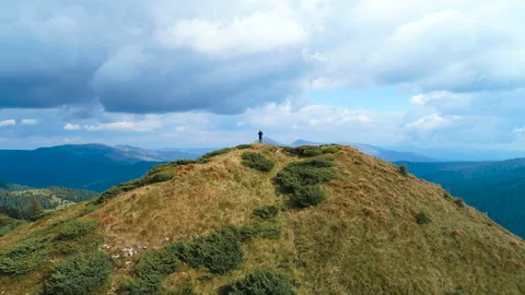 The man standing on the top of the mountain Stock Footage 95251686
