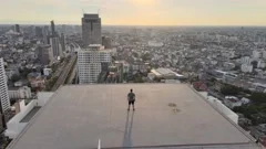 Man needlessly standing on roof overlooking cyberpunk city posing