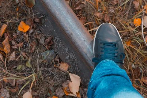 A man is standing on the tracks Stock Photos