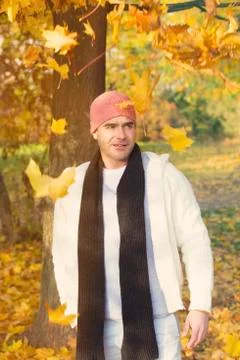 Man standing by a tree in fall Stock Photos