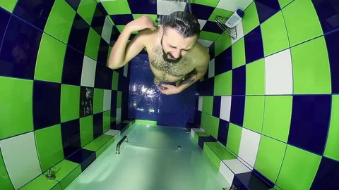 Man standing under shower Stock Footage 83557640