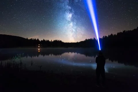 Man Standing Under The Starry Night Sky, Lighting With Head Lamp Stock Photos