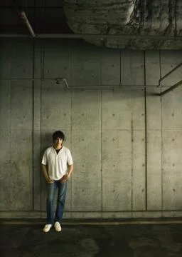 Man standing by wall Stock Photos