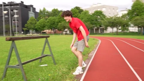 Man standing warming up and stretching before running Stock Footage 299896402
