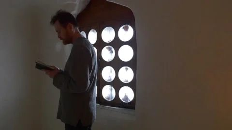 Man Standing at the Window Book in His Hands Tourist in Church Chapel Inside Stock Footage 63162269