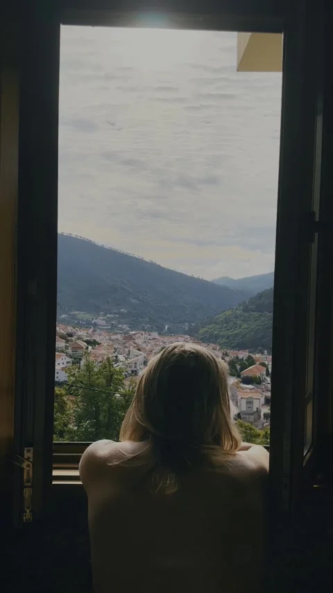 Man Standing in Window Frame Overlooking Portuguese Mountains. Stock Footage 328350761