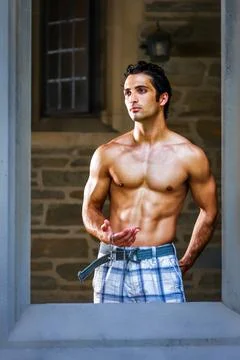 Man Standing by a Window. Stock Photos