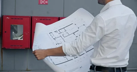 The man stands against the background of red fire shields Stock Footage 250120297