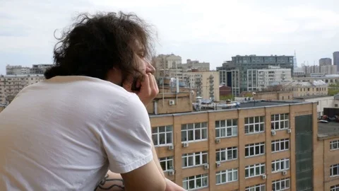 Man stands on the balcony Video stock 75751711