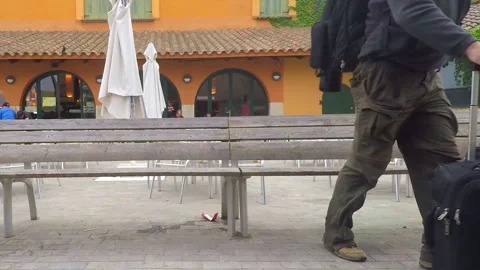 Man Stands Up From Bench With Luggage 스톡 동영상 98034604