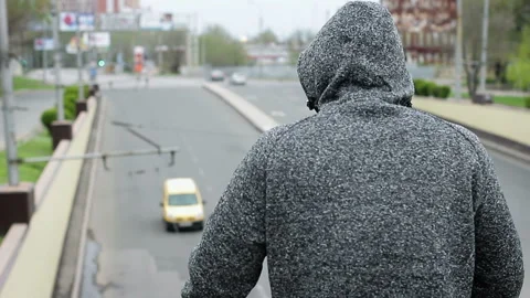 A man stands on the bridge wanting to jump down Video stock 100364372