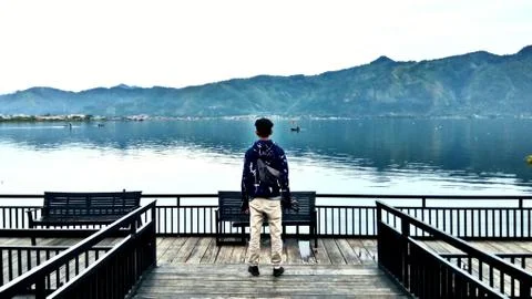 A man stands on the edge of the dock Stock Photos