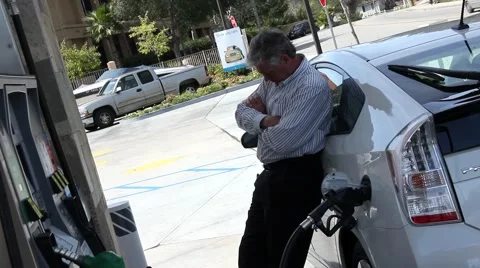 MAN STANDS BY GAS PUMP Video stock 2174152