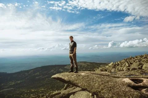 A man stands in the mountains Stock Photos