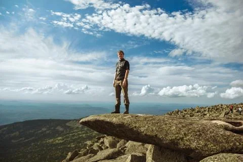 A man stands in the mountains Stock Photos