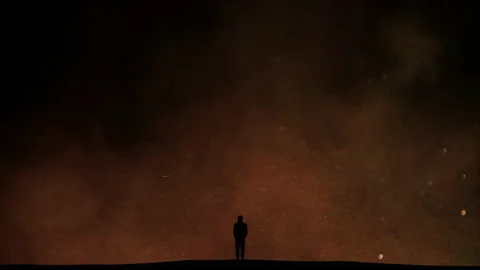 The man stands on the night flying particles background Stock Footage 165356242