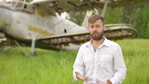 A man stands at the old plane Stock Footage 93174703