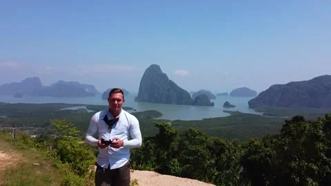 A man stands on a platform against the backdrop of the Phanga National Park Stock Footage 169755074