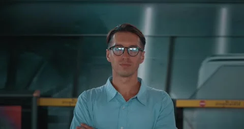 Man stands on platform with his back to train. Train passes by handsome man Stock Footage 263407490