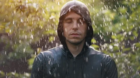 Man stands in the rain 스톡 동영상 157259890