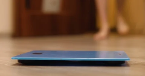 A man stands on the scales Stock Footage 86693578