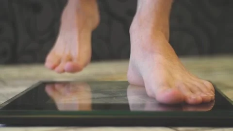 The man stands on the scales. Stock Footage 97332886