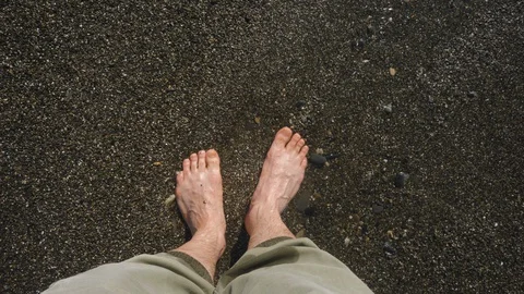 A man stands on the seashore Stockbeeldmateriaal 130083454