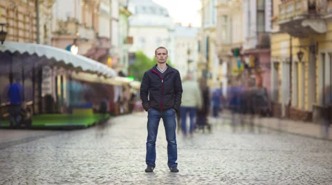The man stands in the smashed silhouette crowd, time lapse Stock Footage 37620058
