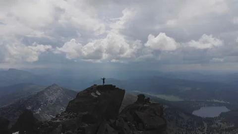 A man stands on top of a mountain. Video stock 92041491