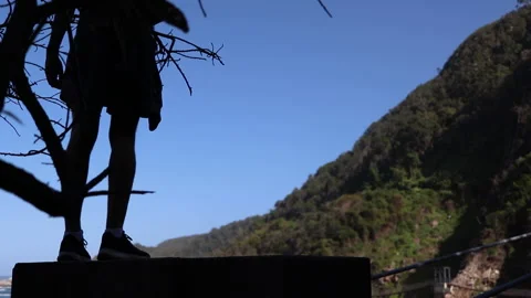 Man stanfing on hiking platform Stock Footage 199219833