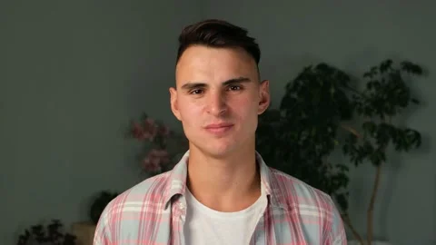 Man staring at camera with serious expression. Stock Footage 169164019