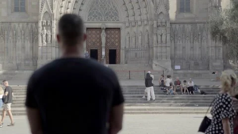 Man staring a cathedral Video stock 140106131