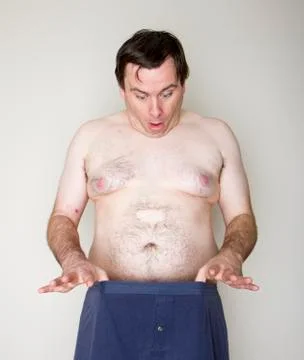 Man staring at his junk Stock Photos