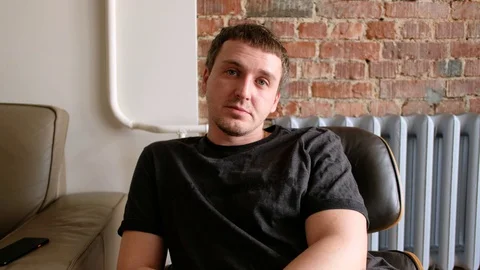 Man staring at webcam cam Stock Footage 129654190