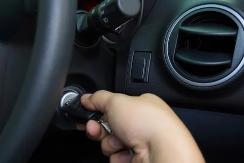 A man starting the car. Stock Photos