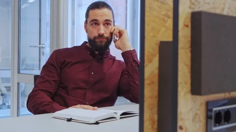 Man starting conversation on the mobile phone in the office Stock Footage 101744753