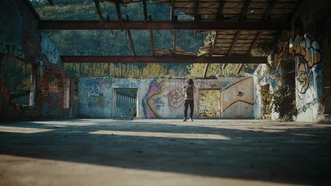 Man starting to dance in abandoned building with no roof Video stock 117917996